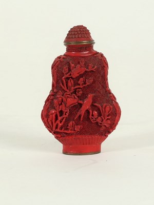 Lot 273 - A Chinese cinnabar lacquer snuff bottle and...