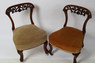 Lot 299 - A pair of Victorian walnut nursing chairs, one...