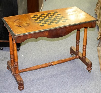 Lot 318 - A Victorian walnut inlaid games table on twin...