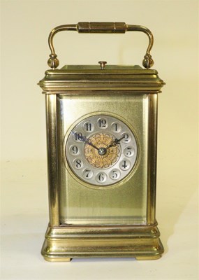 Lot 1038 - A gilt brass carriage clock, the circular...