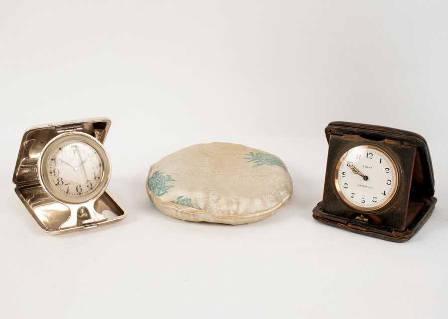 Lot 1050 - A silver cased bedside clock by Elgin, the...