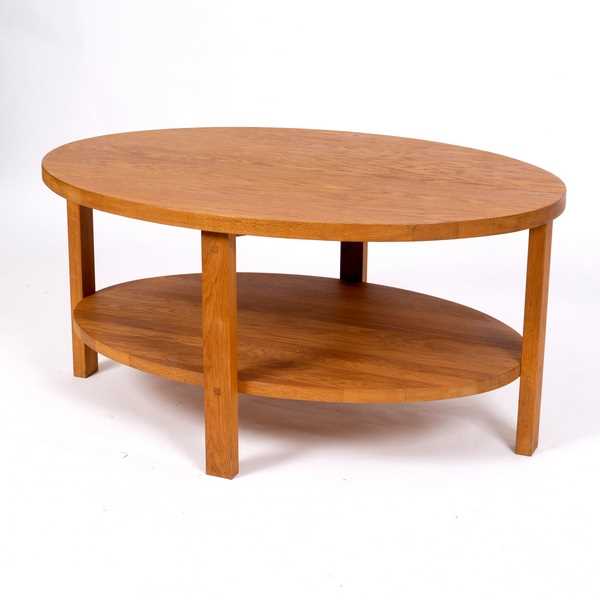 Lot 329 - A Laura Ashley modern oak oval coffee table,...