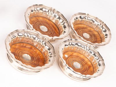 Lot 135 - A set of four Victorian silver wine coasters