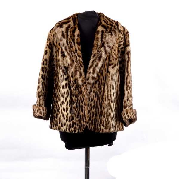 Lot 660 - An ocelot fur jacket, with fold back cuffs and...