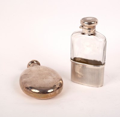 Lot 27 - An oval silver hip flask, Birmingham 1900,...