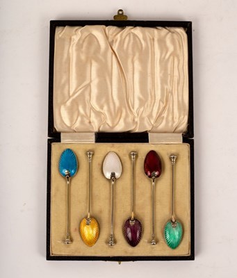 Lot 64 - A set of six silver gilt and coloured enamel...