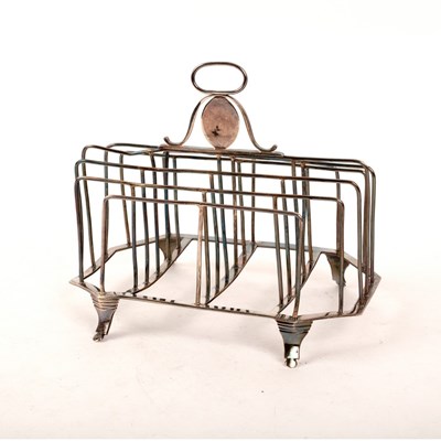 Lot 86 - A George III provincial silver toast rack,...