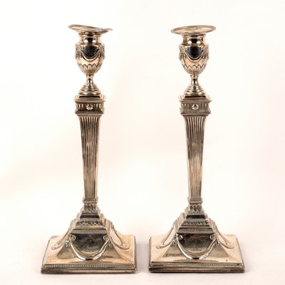 Lot 92 - A pair of George III silver candlesticks,...