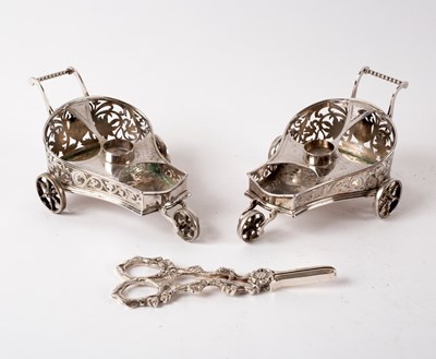 Lot 136 - A pair of plated novelty cruet stands modelled...