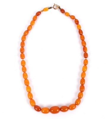 Lot 162 - A Baltic amber necklace of graduated oval...