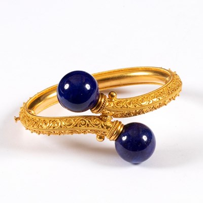 Lot 185 - An Archaeological revival gold and lapis...