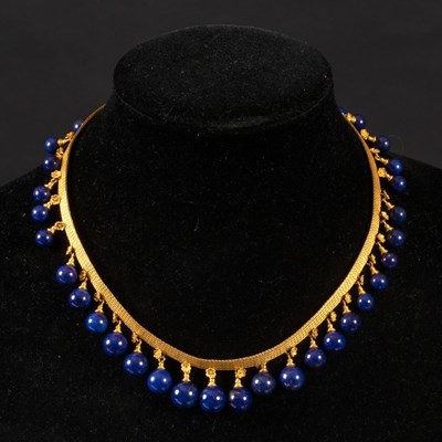 Lot 186 - An Archaeological revival gold and lapis...