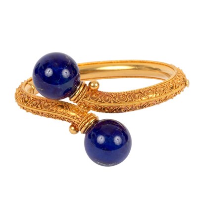 Lot 187 - An Archaeological revival gold and lapis...