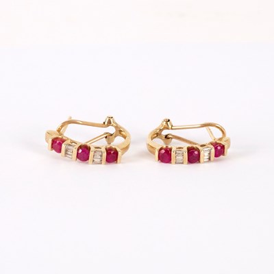 Lot 192 - A pair of ruby and diamond half hoop earrings,...