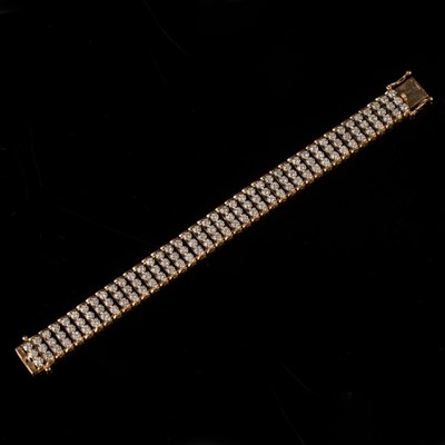 Lot 202 - A diamond bracelet, the three rows of...