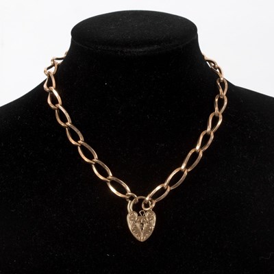 Lot 222 - A 9ct gold chain with a heart-shaped padlock...