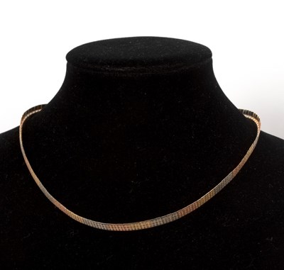 Lot 232 - An 18ct tri-colour gold necklace of flattened...