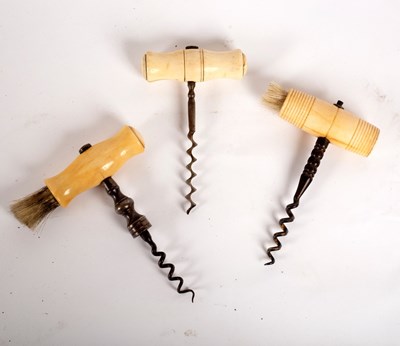 Lot 343 - A steel corkscrew with ivory handle and brush,...