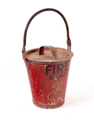 Lot 363 - A red fire bucket with lid, marked 'Fire' with...