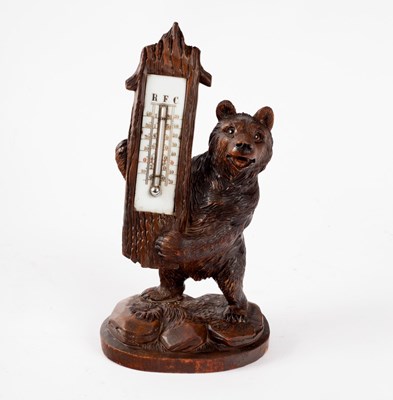 Lot 378 - A Black Forest carved thermometer stand of...