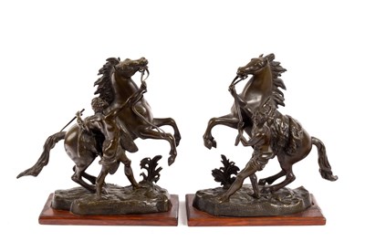 Lot 386 - After Guillaume Coustou/a pair of bronze...