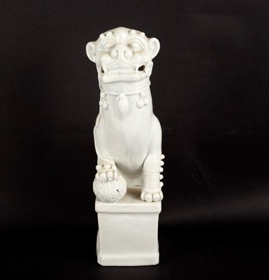 Lot 525 - A blanc-de-chine figure of a dog of fo, 34cm high