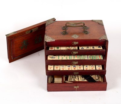 Lot 547 - A Chinese Mah Jong set in a metal mounted...