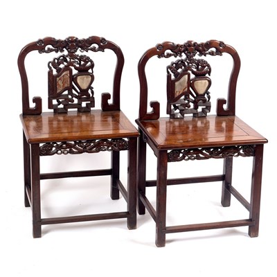 Lot 549 - A pair of Chinese hardwood chairs, the carved...