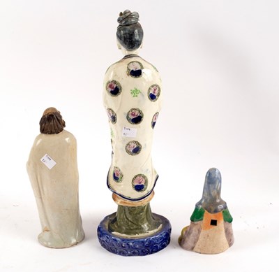 Lot 557 - A Chinese pottery figure of a Luohan, 24cm...