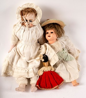 Lot 606 - A composition head doll, a composition doll...