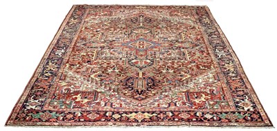 Lot 680 - A Persian Heriz carpet, early 20th Century, of...