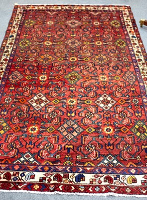 Lot 685 - A Hamadan rug with claret ground, the all over...