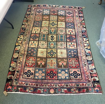 Lot 688 - A Bakhtiari rug, the geometric floral field to...