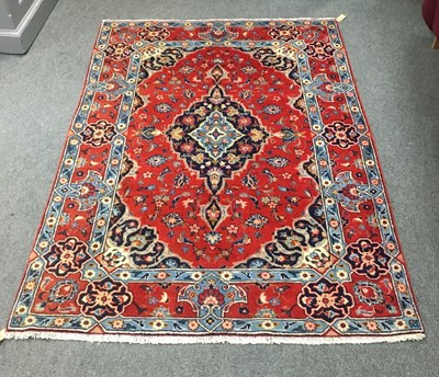 Lot 689 - A Hamadan rug, the red ground with central...