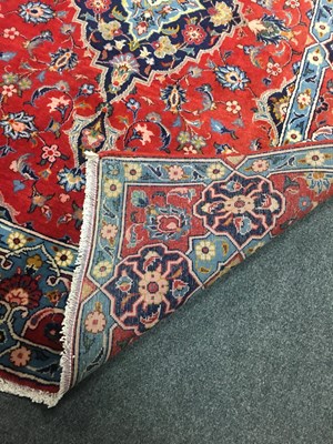 Lot 689 - A Hamadan rug, the red ground with central...