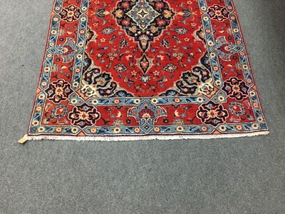 Lot 689 - A Hamadan rug, the red ground with central...
