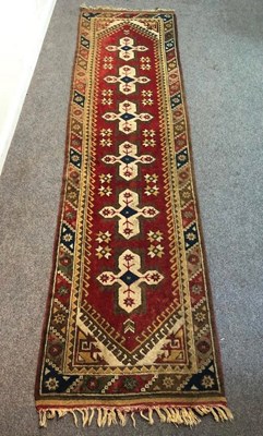 Lot 693 - An Eastern runner, 280cm x 73cm