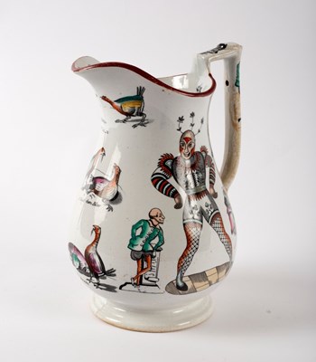 Lot 937 - A Staffordshire harlequin puzzle jug with...