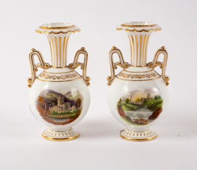 Lot 942 - A pair of English porcelain two-handled...