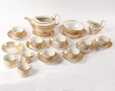 Lot 979 - A John Rose Coalport gilt and white part tea...