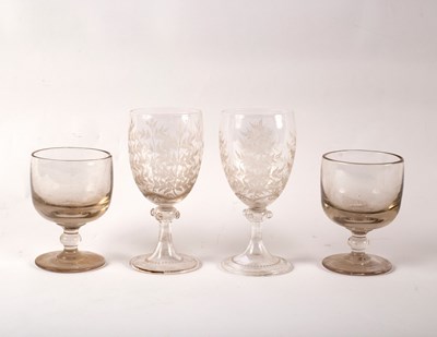 Lot 993 - A pair of wine glasses etched with leaves and...