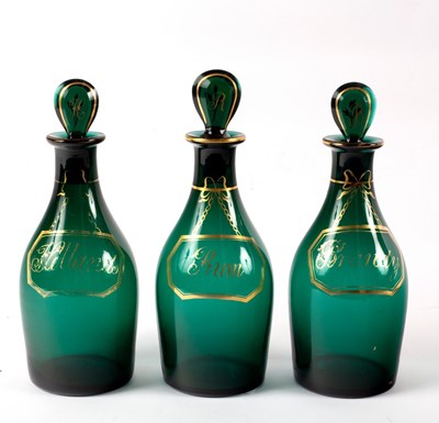 Lot 996 - A set of three 20th Century green glass spirit...