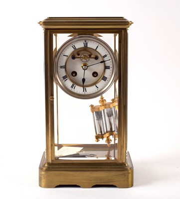 Lot 1006 - A French four-glass brass mantel clock, the...