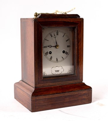 Lot 1020 - A rosewood cased mantel clock, the silvered...