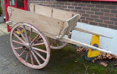 Lot 1042 - A builders' cart, the flat bed with plank...