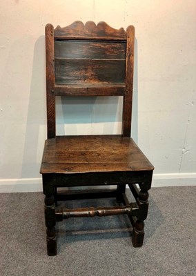 Lot 1049 - An oak side chair with panel back, circa 1700,...