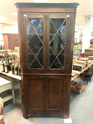 Lot 1053 - A 19th Century oak corner cupboard, the upper...