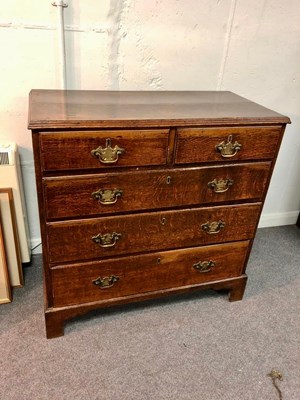 Lot 1054 - A George III oak chest of two short and three...