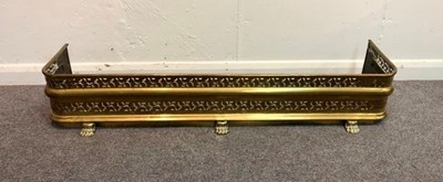 Lot 1057 - A brass fire curb, 121cm wide