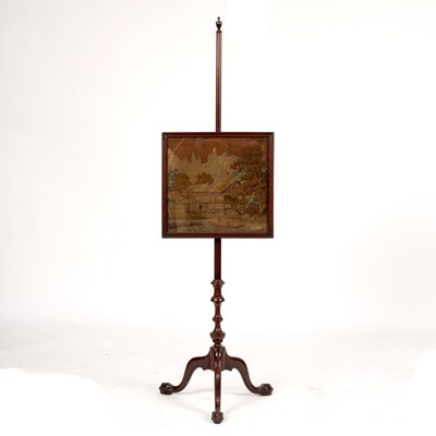 Lot 1068 - A mahogany pole screen with vase finial, the...